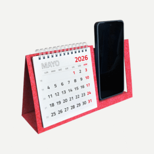 Calendarios con porta celular de escritorio con base contra-placada, 13 hojas papel couche plastificado mate o brillante, impresión full color, anillado doble ring de metal, contamos con plantilla de diseño para personalizar según su requerimiento.